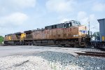 UP 5728 trails on a westbound empty stone train 